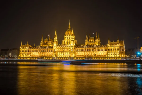 Hungarian Parliament Building on the bank of the Danube in Budapest at night.