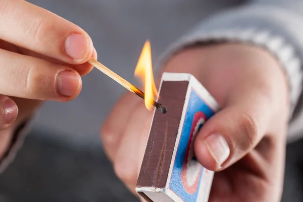 Hold Matchbox While Striking Match — Stock Photo, Image