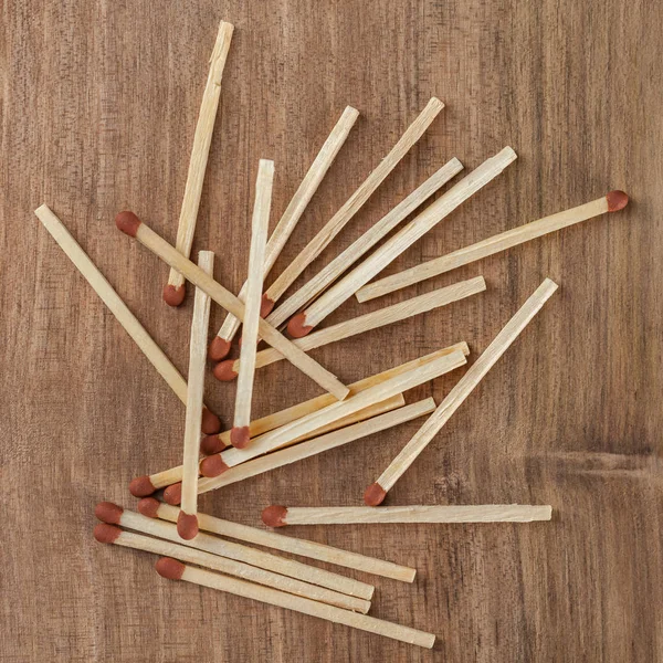 Wooden matches sticks on a wooden table background.