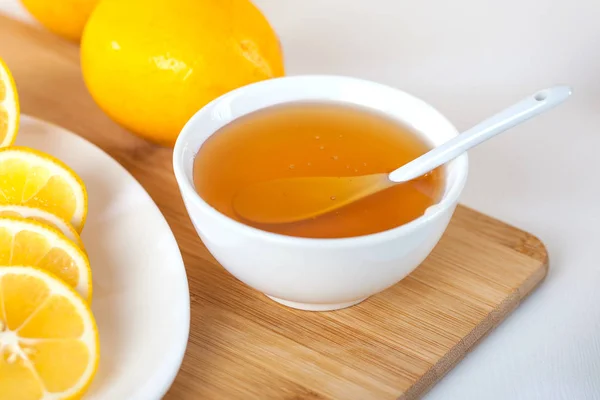 Honey White Ceramic Bowl Spoon Lemon Wooden Kitchen Board — Stock Photo, Image