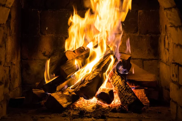 Wood burning in a cozy fireplace at home, keep warm.