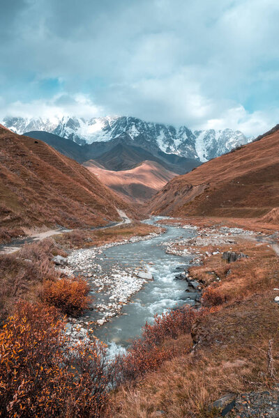 The valley of the Enguri river in autumn. The highest peak of Georgia is Shkhara. Main Caucasian ridge, Zemo Svaneti.