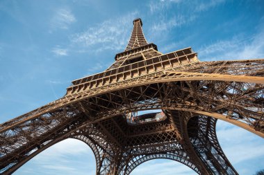 Wide shot of Eiffel Tower with blue sky, Paris, France. clipart