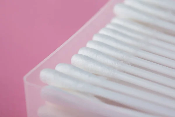 Sticks for cleaning ears on a pink background — Stock Photo, Image
