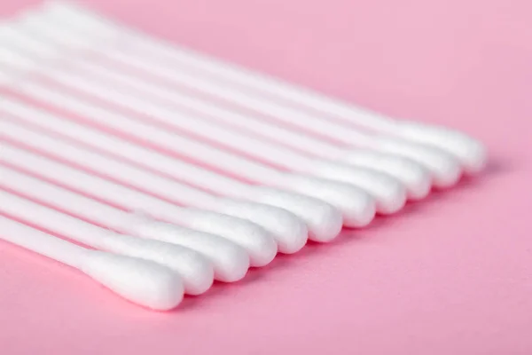 Sticks for cleaning ears on a pink background — Stock Photo, Image