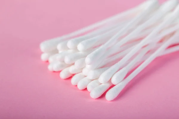 Sticks for cleaning ears on a pink background — Stock Photo, Image