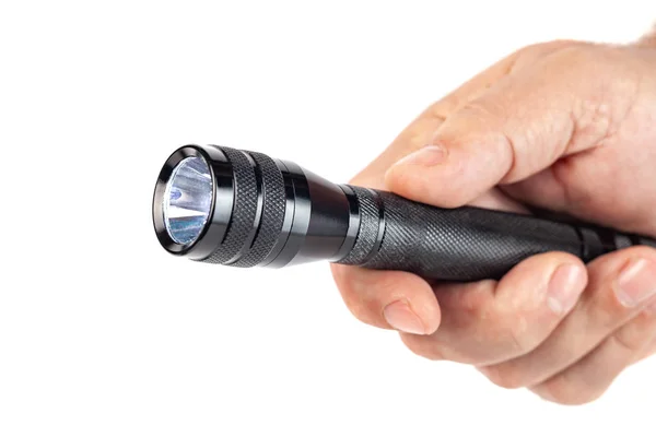 Hand holding flashlight on white background — Stock Photo, Image