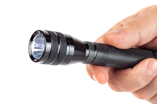 Hand holding flashlight on white background — Stock Photo, Image
