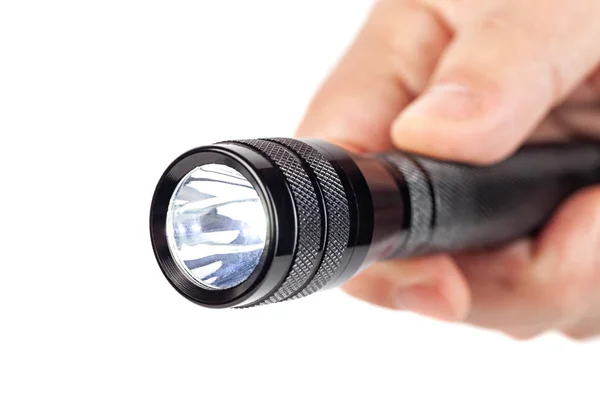 Hand holding flashlight on white background — Stock Photo, Image