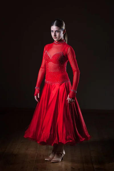 Young hispanic flamenco dancer in red dress isolated on black ba — Stock Photo, Image