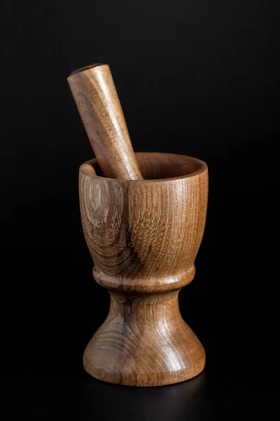 Wooden mortar (pounder) and pestle isolated on black background — Stock Photo, Image