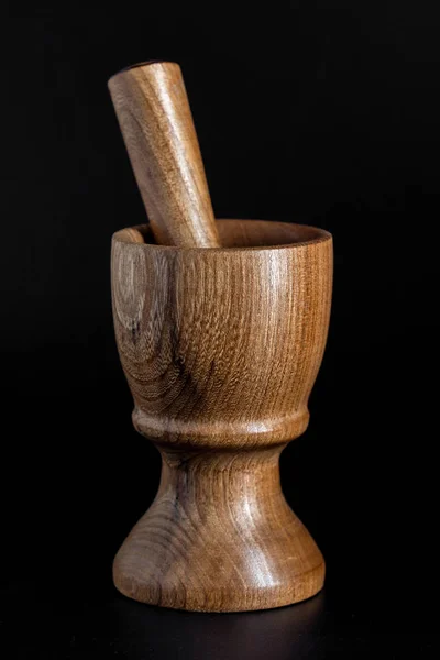 Wooden mortar (pounder) and pestle isolated on black background — Stock Photo, Image