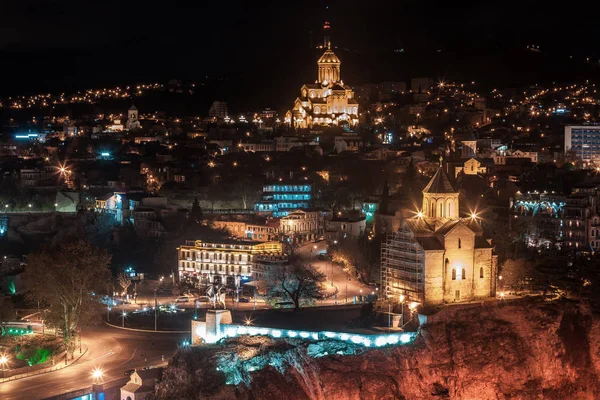Night view of Tbilisi with Sameba (Trinity) Church and other lan