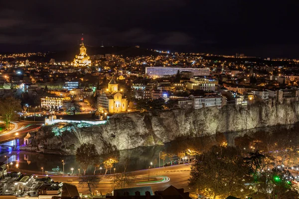 Night view of Tbilisi with Sameba (Trinity) Church and other lan