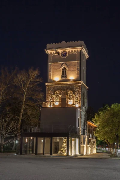 Night view of old clock tower in Poti, Niko Nikoladze tower. Geo