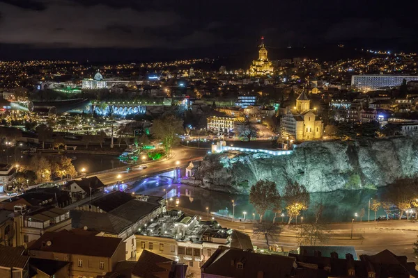 Night view of Tbilisi with Sameba (Trinity) Church and other lan