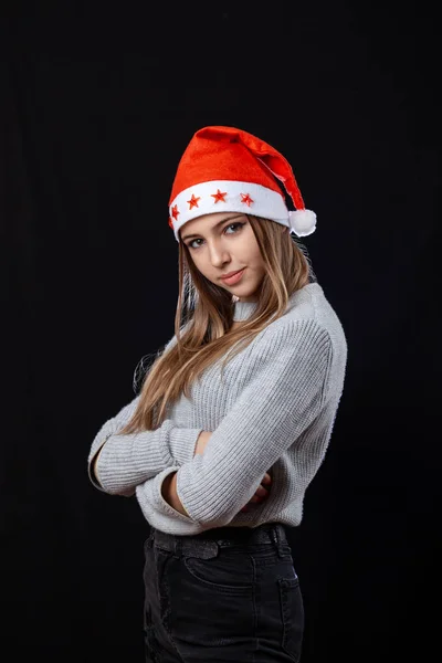 Beautiful girl posing on the black background in New Year outfit — Stock Photo, Image