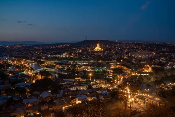 Night view of Tbilisi with Sameba (Trinity) Church and other lan