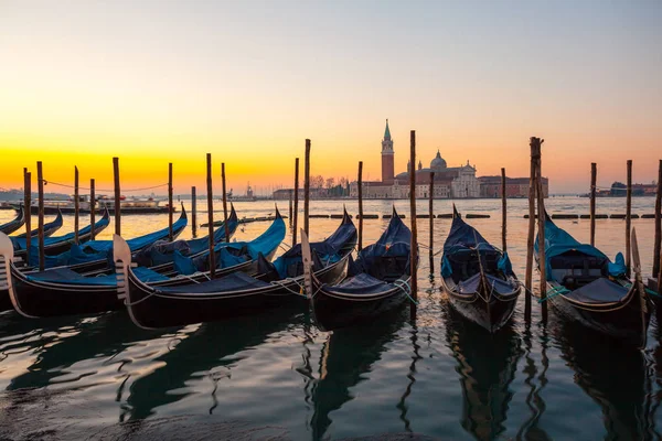 Sunrise at Venice with gondola and island of st george view from