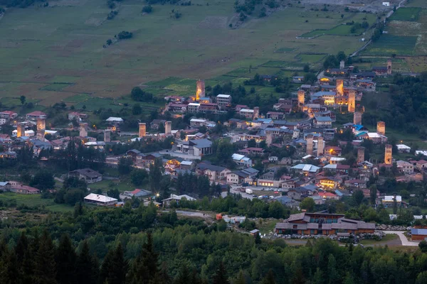 Evening view on Mestia with its beautiful illuminated Svan Tower — Stock Photo, Image