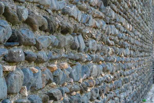 Konsistens av gamla bergvägg för bakgrund, medeltida stenmur. — Stockfoto