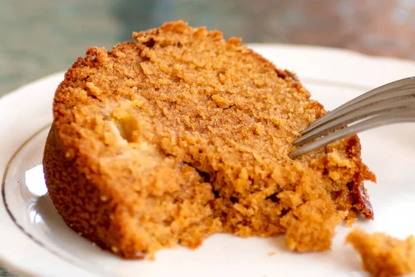 Baked pudding dessert in the plate with a fork, sweets