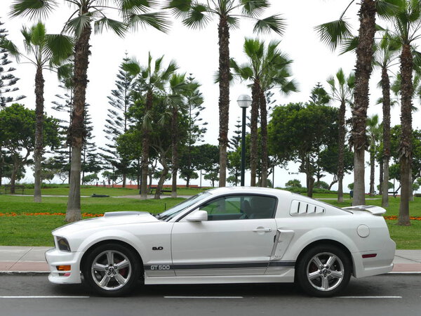 Lima, Peru. October 30, 2017. Skill condition of a white and black Ford Mustang GT500 5.0 V8 with aluminium wheels built by Ford Motor Company in the USA and parked alongside a park in Miraflores district of Lima. The photo was taken on a clear day 