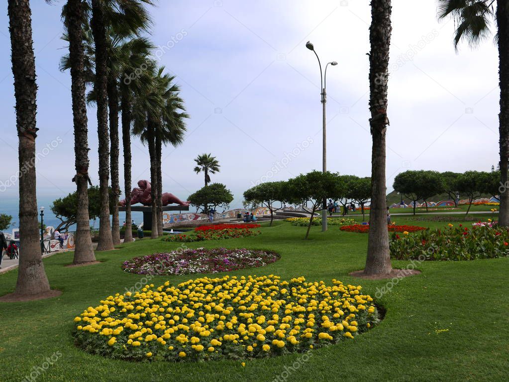 Scenic view of ornate multi colored modern ornamental garden in the love park (Parque del Amor) in Miraflores touristic district of Lima. The park is built over the big cliff at the coastline of the Pacific Ocean