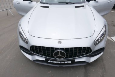 Lima, Peru. September 22, 2018. Front view of a new 2018 Mercedes-AMG GT S V8 biturbo silver color exhibited in Chorrillos district of Lima. Both doors are opened. It is the top of the line Mercedes-Benz AMG sports car. clipart
