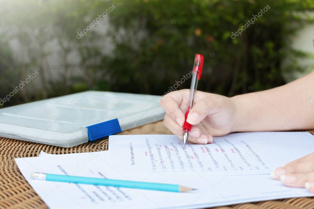 proofreading paper on table for editing