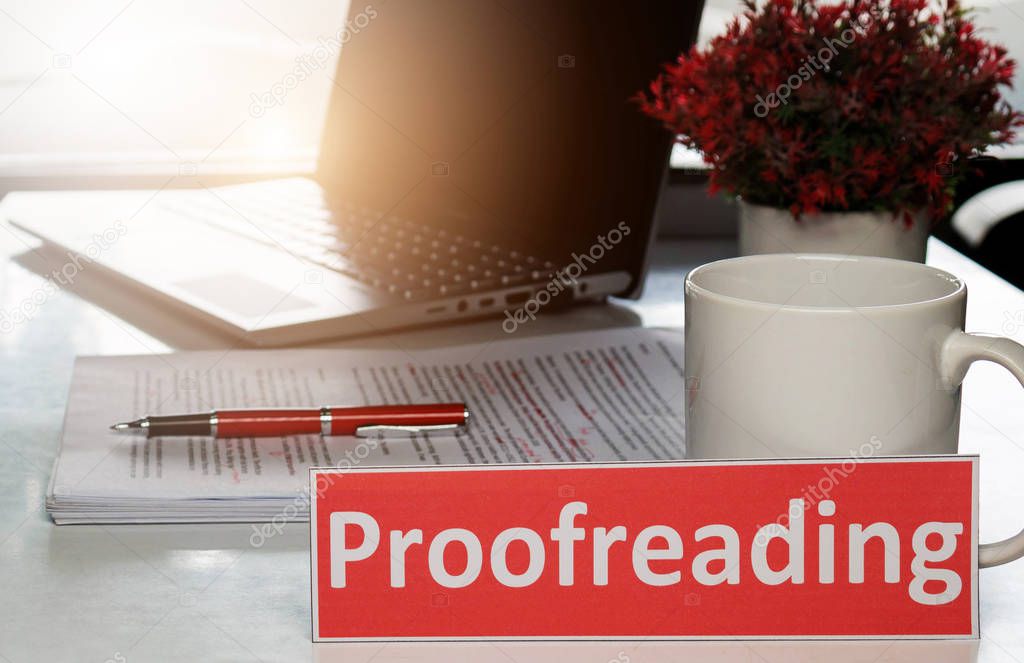 proofreading paper on white table