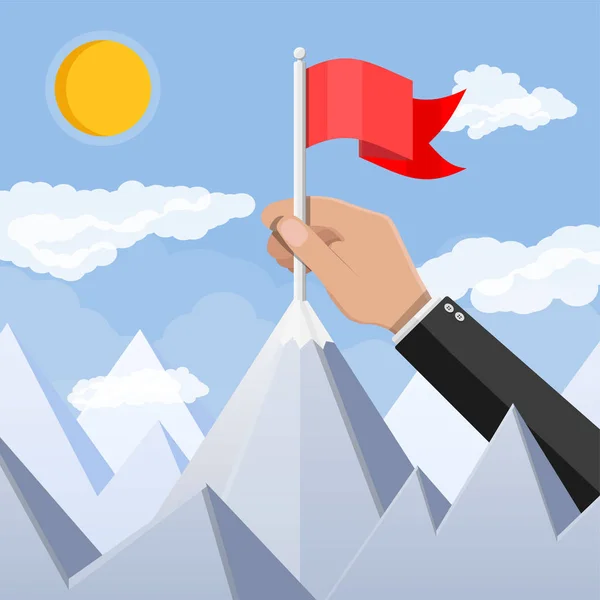 Businessman hand puts flag on peak of mountain. — Stock Vector