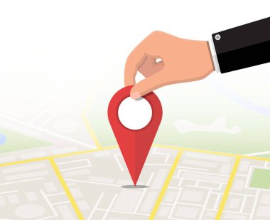 Elinde yer pini ve harita.