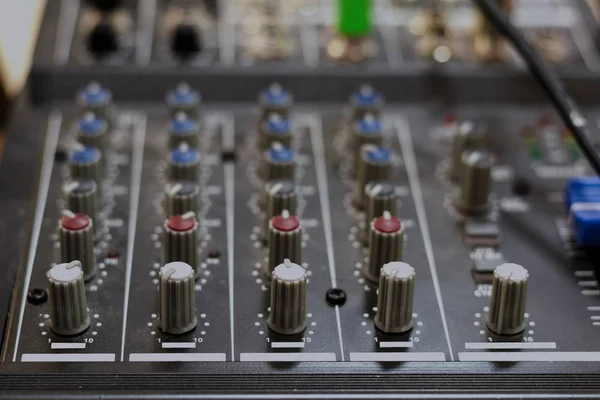 Audio mixing board. Sound mixing console and buttons of mixer controller. Toned. Close-up.