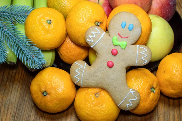 Christmas homemade gingerbread in the form of a little man on a — Stock Photo, Image