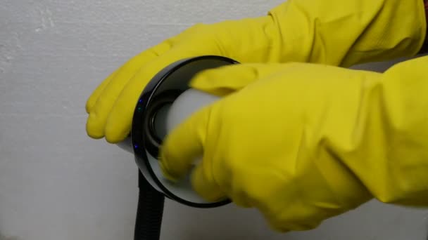 Human Hand Yellow Rubber Glove Unscrews Damaged Light Bulb Base — Stock Video