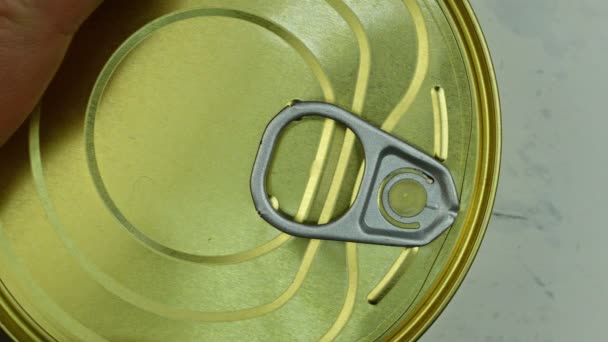 Hands tear off lid in tin can with canned sprats in vegetable oil. Close-up. — Stock Footage Hands tear off lid in tin can with canned sprats in vegetable oil. Close-up. Stock Video