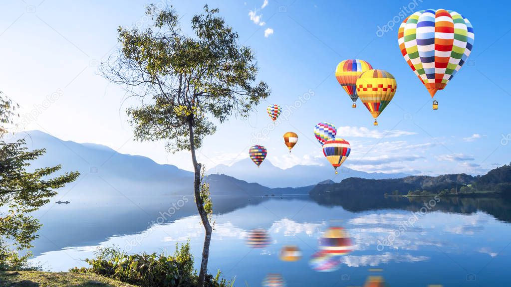 Colorful hot air balloon fly over beautiful landscape view of Su