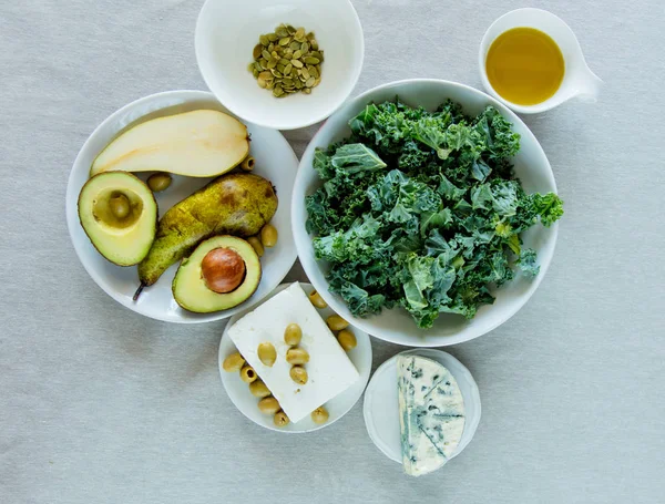 Top View Ingredients Mediterranean Salad Pear Olives Brie Cabbage Stone — Stock Photo, Image