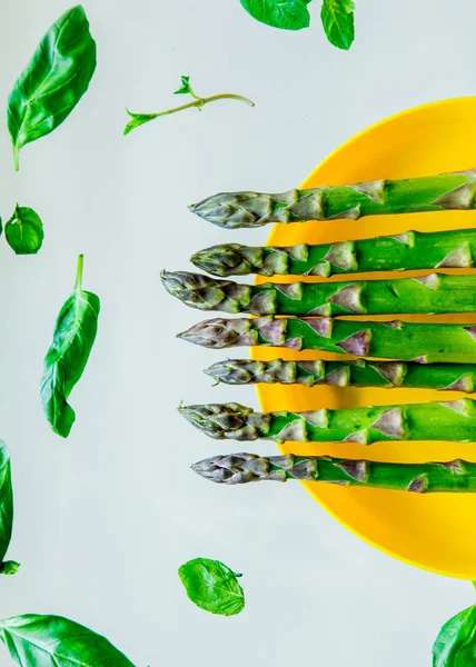 Fresh green Asparagus and basil leaves — Stock Photo, Image
