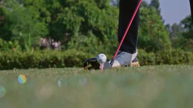A golfer hits a golf ball with a golf club in Jakarta, Indonesia on September 13, 2025.