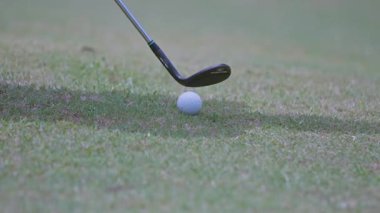 A golfer hits a golf ball with a golf club in Jakarta, Indonesia on September 13, 2025.