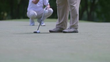 A golfer hits a golf ball with a golf club in Jakarta, Indonesia on September 13, 2025.