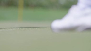 A golfer hits a golf ball with a golf club in Jakarta, Indonesia on September 13, 2025.