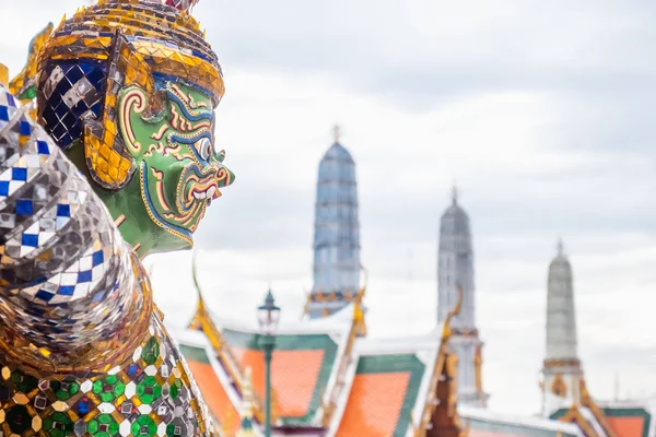 Guardian statues at the base of the Golden Chedi of Wat Phra Kaew, Grand Palace, Bangkok