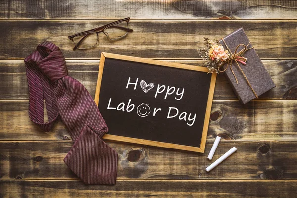 Happy Labor\'s day concept. Flat lay image of gift box, necktie,
