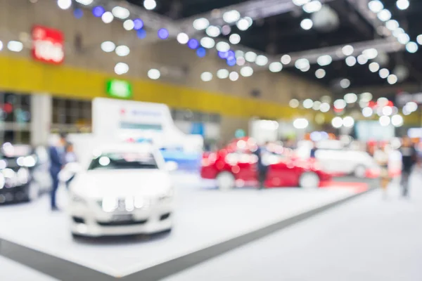 Abstract blurred image of cars exhibition show. Blurred defocuse