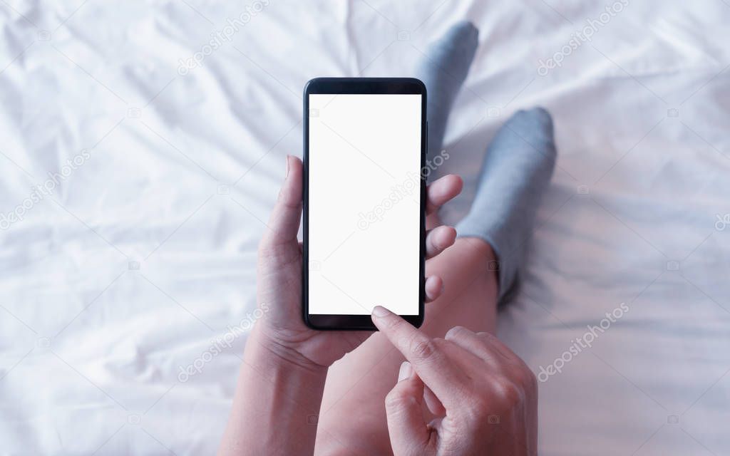 Mockup smartphone. Female holding cell phone with blank copy spa