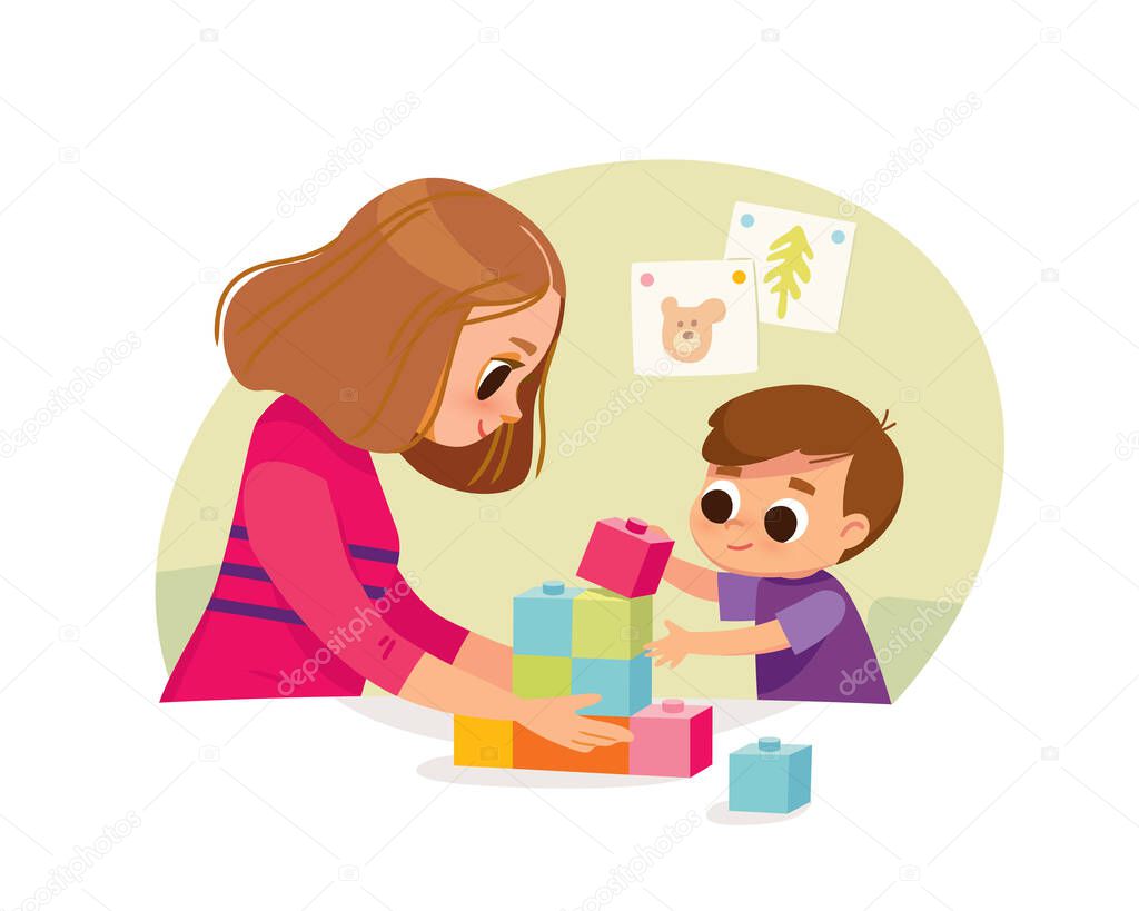 Mother playing with kid at home. Educational toys. Child playing designer cubes, developmental constructor.