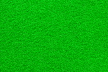 Yeşil keçeli masa yüzeyine yakın çekim. Büyük makro doku ve arkaplan